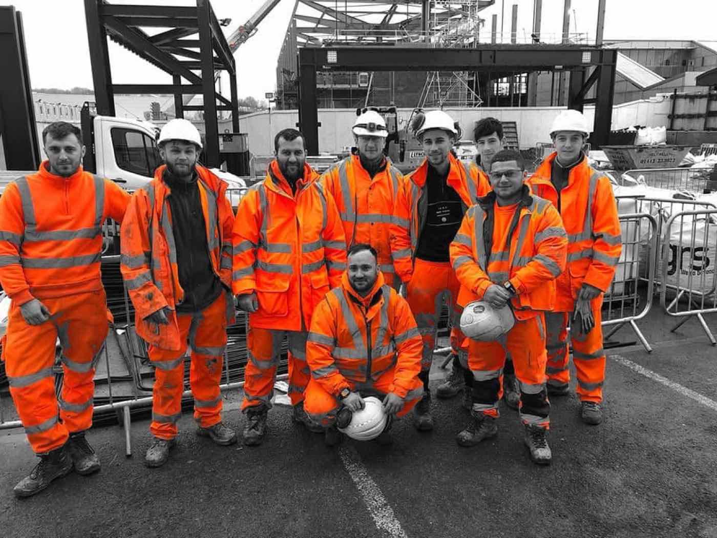 Servo Rail operatives in orange PPE on site